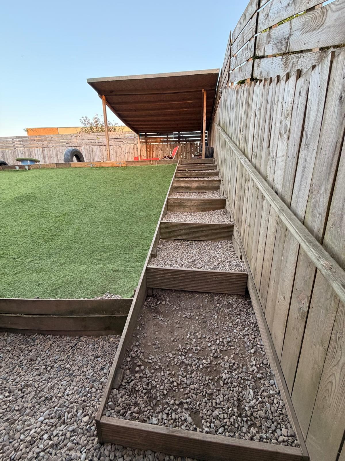 Steps leading down to the lower part of the outdoor paddock